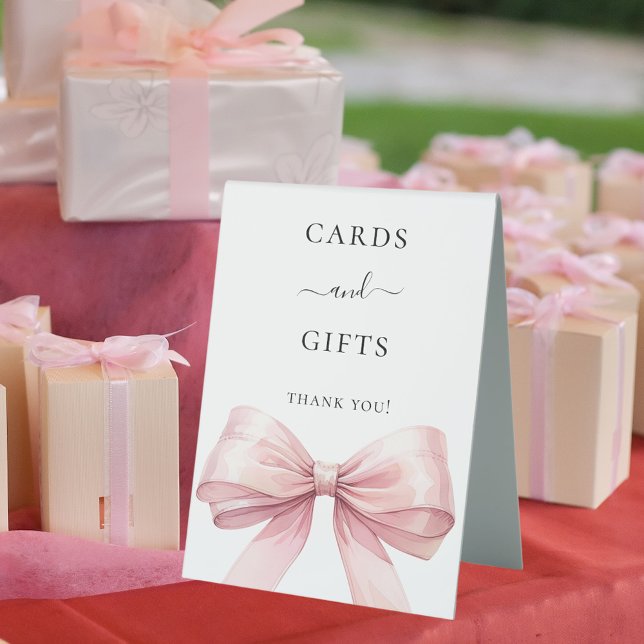 Pink bow white cards gifts sign (Creator Uploaded)
