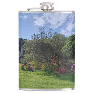Pink bushes in the park hip flask