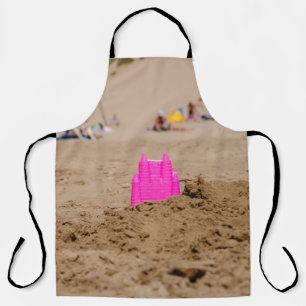 Pink castle toy in shore at daytime apron