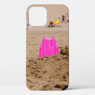 Pink castle toy in shore at daytime iPhone 12 case