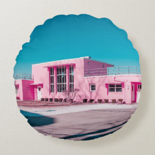 Pink concrete building under clear blue sky round cushion
