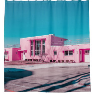 Pink concrete building under clear blue sky shower curtain
