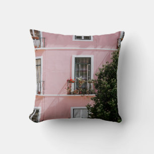 PINK CONCRETE COMMERCIAL BUILDING NEAR GREEN TREE CUSHION