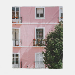 PINK CONCRETE COMMERCIAL BUILDING NEAR GREEN TREE FLEECE BLANKET