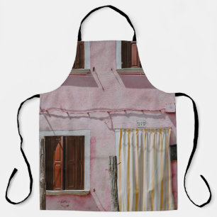 PINK CONCRETE HOUSE WITH THREE WINDOWS AND ONE DOO APRON