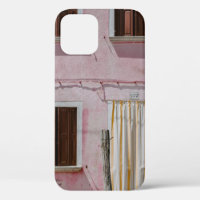PINK CONCRETE HOUSE WITH THREE WINDOWS AND ONE DOO