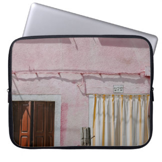 PINK CONCRETE HOUSE WITH THREE WINDOWS AND ONE DOO LAPTOP SLEEVE