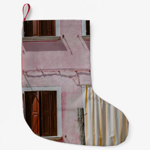 PINK CONCRETE HOUSE WITH THREE WINDOWS AND ONE DOO SMALL CHRISTMAS STOCKING