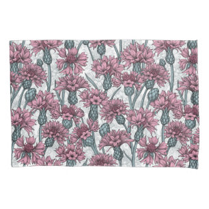 Pink cornflowers, wild flowers on white pillowcase