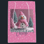 Pink Crocheted Christmas Snowman Medium Gift Bag<br><div class="desc">Pink Crocheted Christmas Snowman Gift Bag
Pretty Pink Background. Snowmans Hat,  Scarf
and Trees are of a Crocheted Digitally Created
Design. Merry Christmas written
across the Bottom in a Green Colour, 
Snowflakes to cover. Anyone would
love to get a gift in this bag.</div>