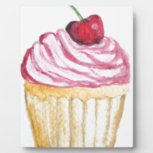 Pink cupcake with cherry plaque