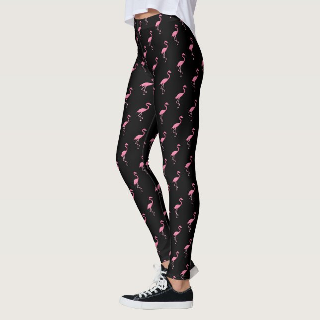 Pink flamingo illustration on black pattern leggings (Left)