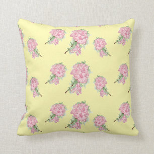 Pink flowers on yellow cushion
