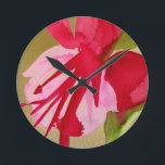 Pink Fuchsia pop art watercolour flower Round Clock<br><div class="desc">From an original watercolour painting of a bright pink fuchsia flower in vivid pop art style against a golden background. This design is arty and bright and would bring a pop of pop art color to any situation.</div>