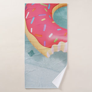 Pink inflatable doughnut floater bath towel