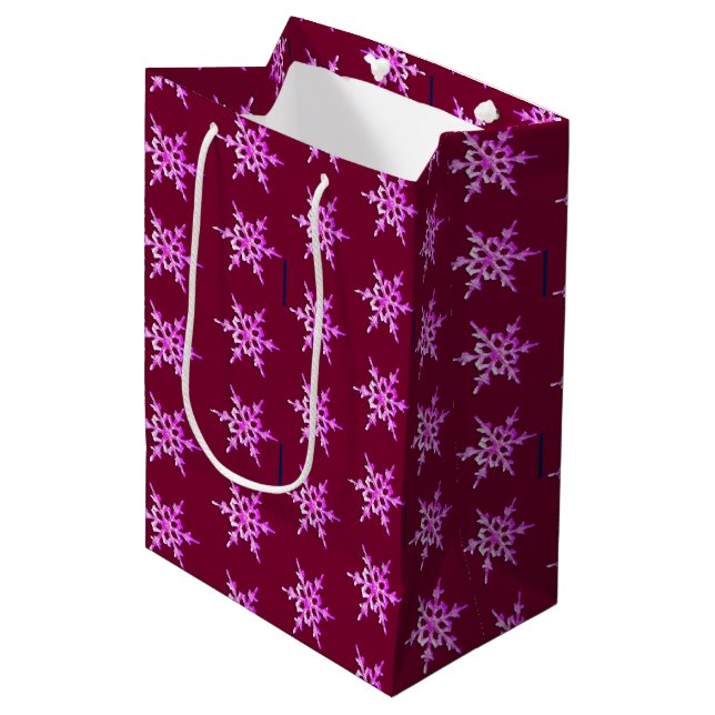 Pink iridescent snowflake on burgundy medium gift bag (Front Angled)