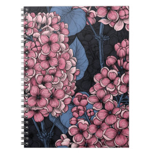 Pink lilac on dark blue notebook