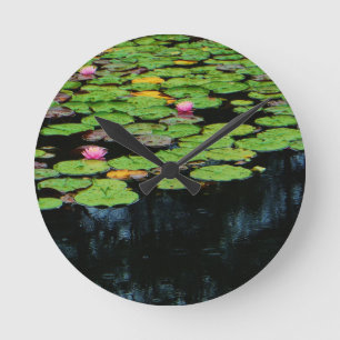 pink lotus black round clock
