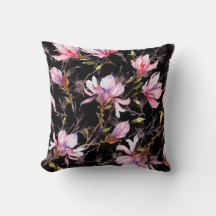 Pink magnolia flowers on a twig pattern cushion