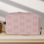 Pink monogram Simple Modern, Womens Dopp Kit<br><div class="desc">Crafted for the modern woman on the go, this Pink Monogram Simple Modern Women's Dopp Kit Bag is the epitome of elegance and functionality. Its dusty pink hue, combined with a sleek monogram design, offers a girly yet sophisticated aesthetic perfect for any travel or golfing adventure. Designed with simplicity in...</div>