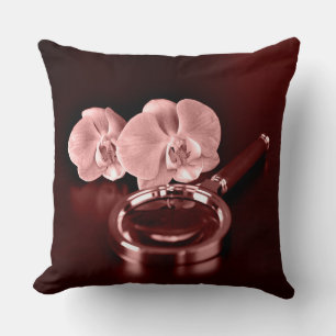 Pink orchid flowers and magnifying glass cushion