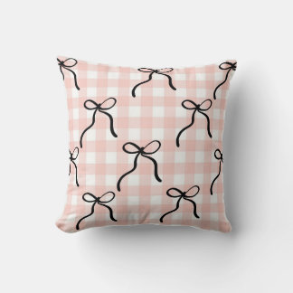 Pink pillow with black bows