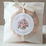 Pink Poinsettias Personalised Merry Christmas Classic Round Sticker<br><div class="desc">These floral holiday stickers feature a watercolor basket of pink and white poinsettias. The words "Merry Christmas" appear in beige serif font,  with your family's name below.</div>