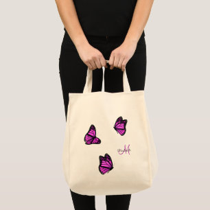 pink purple butterflies flitting on a breeze tote bag