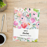 Pink purple watercolored flowers 2026 planner<br><div class="desc">Watercolored flowers in blush pink and purple. A soft blush pink background,  decorated with a large bow.</div>