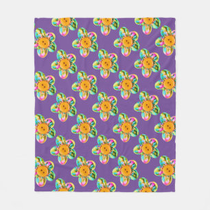 Pink, purple, yellow flowers on dark violet fleece blanket