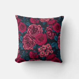 Pink, red and bi-colour roses with blue leaves on  cushion