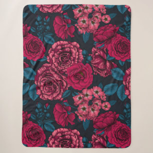 Pink, red and bi-colour roses with blue leaves on  sherpa blanket