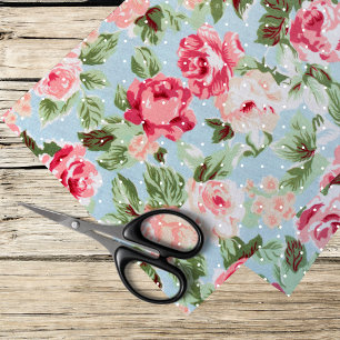 pink roses and white polka dots on light blue tissue paper