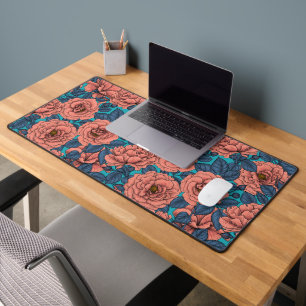 Pink roses with blue leaves on blue desk mat