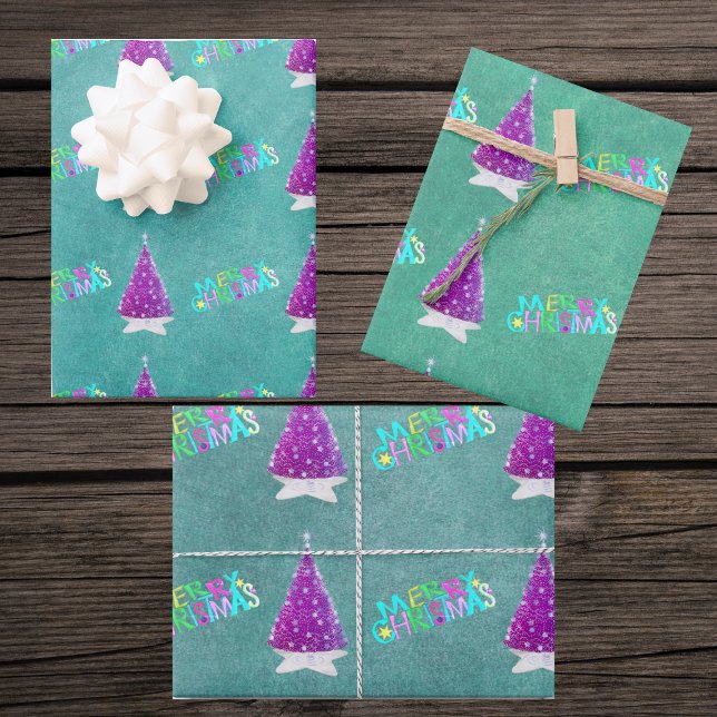 Pink Silver Trees Colourful Merry Christmas Text Wrapping Paper Sheet (Pink silver trees bright Merry Christmas on blues and green sheets of gift wrapping paper.)