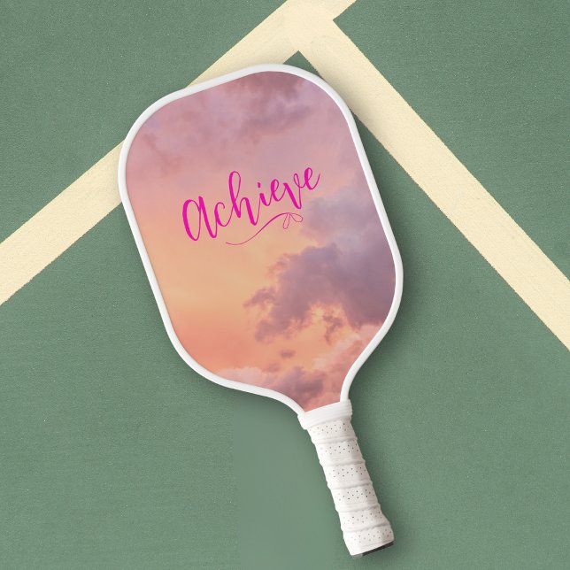 Pink Sky Clouds Photo Motivational Pink Script Pickleball Paddle (Peachy pink and purple sky photo pickleball paddle with hot pink motivational text, achieve.)