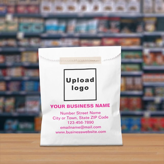 Pink Text Business Brand on Paper Bag (Paper bag with pink text business branding displayed in a store)