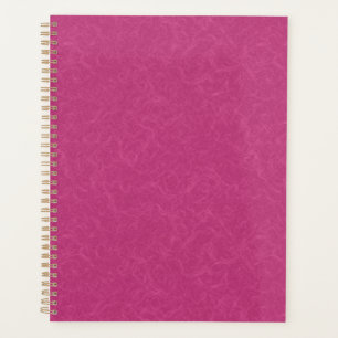 Pink textured surface with swirling pattern planner