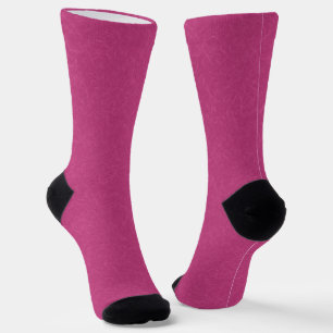 Pink textured surface with swirling pattern socks
