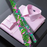 Pink Tropical Hawaiian pattern  Tie<br><div class="desc">The Hawaiian print men's neck tie features a captivating illustration of green and pink tropical leaves, exuding a vibrant and eye-catching design. The tie showcases a harmonious blend of lush green leaves and vibrant pink accents, creating a visually striking combination. The green leaves symbolise the abundant foliage found in the...</div>