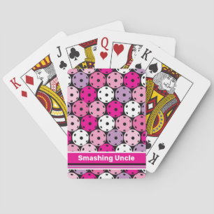 Pink, white and purple pickleballs, playing card