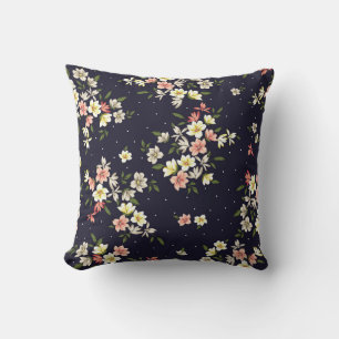 pink yellow and brown small flowers with green lea cushion