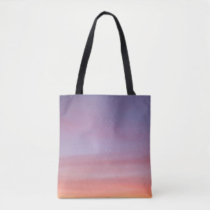 Pink, yellow, and purple cloudy sky tote bag