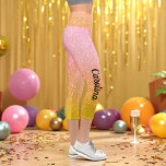 Pink Yellow Gold Glitter Ombre Sparkle Capri Leggings<br><div class="desc">Pink Gold Yellow Glitter Ombre Sparkle Capri Leggings with Faux Pink Yellow Glitter background and name in black. Use personalise this template option to change the text | Use customise further option to change the text style,  size and colour if required. If you don’t need text,  delete it.</div>