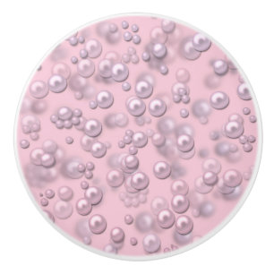 Placers of white-pink pearls on pink velvet ceramic knob