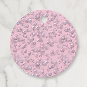 Placers of white-pink pearls on pink velvet favour tags