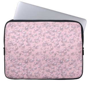 Placers of white-pink pearls on pink velvet laptop sleeve
