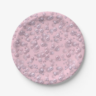 Placers of white-pink pearls on pink velvet paper plate