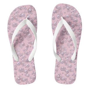 Placers of white-pink pearls on pink velvet thongs