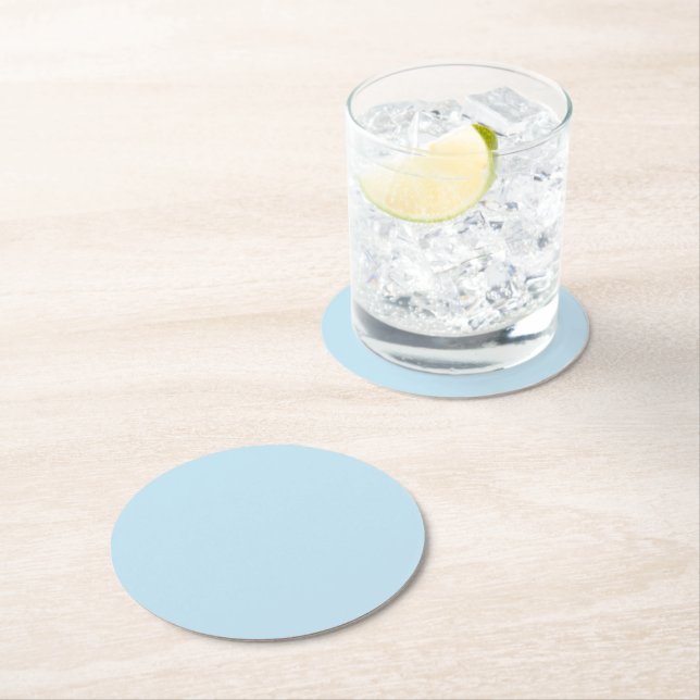Plain colour solid cloudy light blue round paper coaster (Insitu)